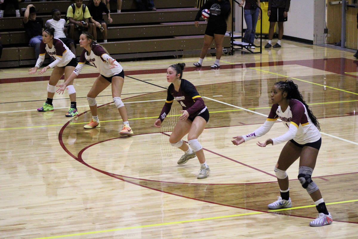 Lady Trojans junior #8 Xe’ane Kamanu (left), junior Riley Saldana #7 (middle left), sophomore ...