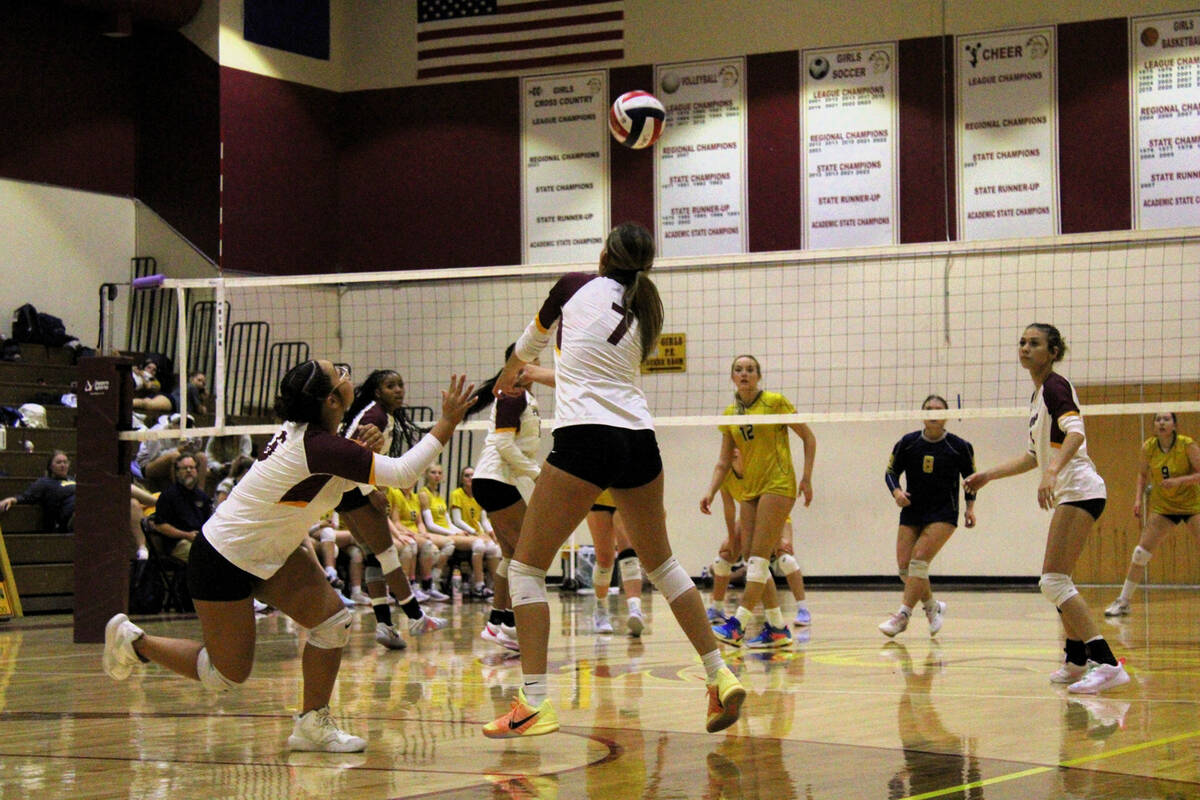 Lady Trojans junior Riley Saldana #7 anticipates returning a hard serve in a league game agains ...