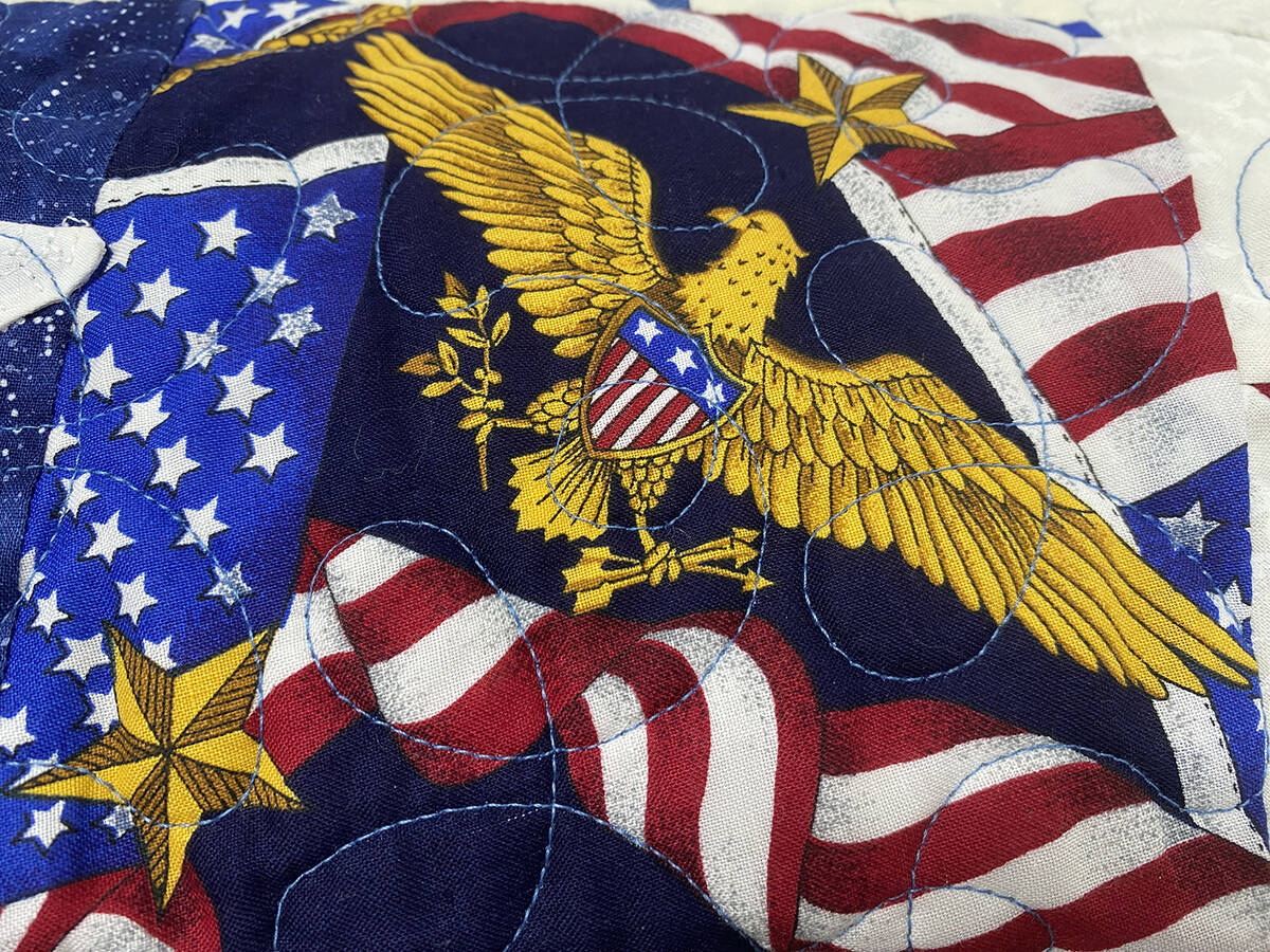 Patriotic themed material featuring iconic images such as an eagle and the stars and stripes wa ...