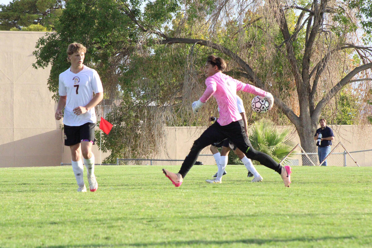 Pahrump Valley High School soccer senior goalkeeper Cayden Cowley delivers a ball back onto the ...