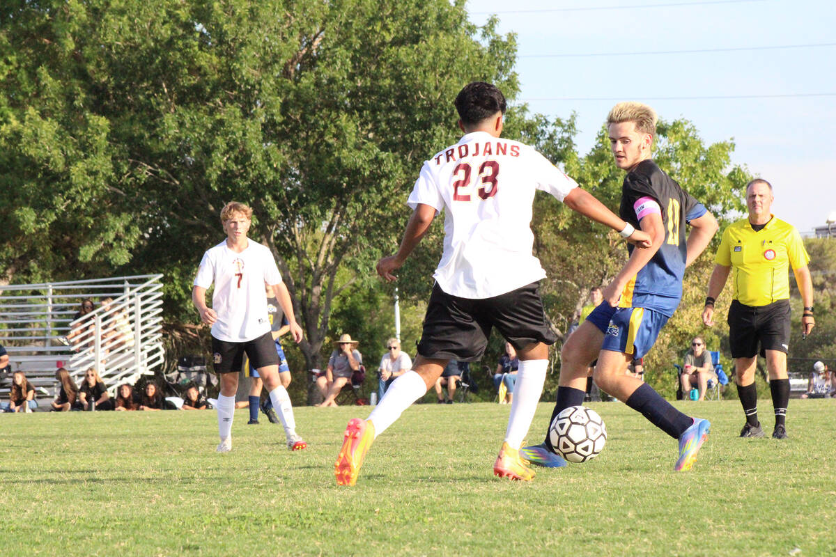 Trojans senior forward Favyan Sida advances the ball up field in a league match against Boulder ...