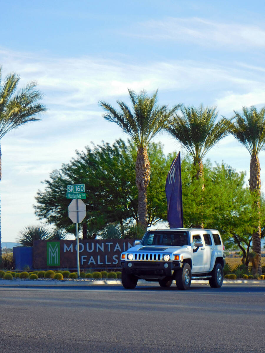 A motorist waits to execute a left-hand turn onto Highway 160 from Mountain Falls Blvd. on Tues ...