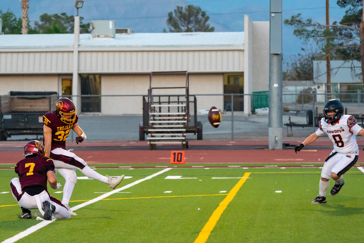 Pahrump Valley High School senior Joshua Slusher converts one of his four point after attempts ...