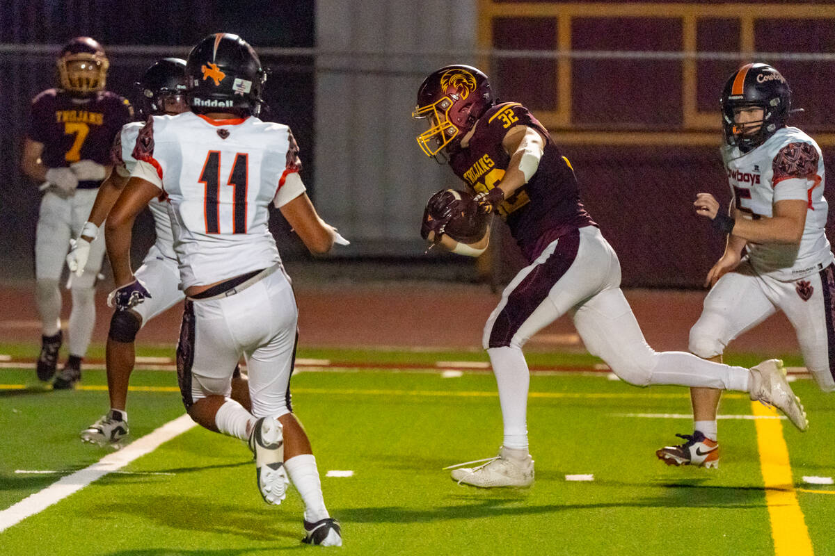 Pahrump Valley High School senior RB/LB Joshua Slusher rumbles in for a three yard rushing touc ...