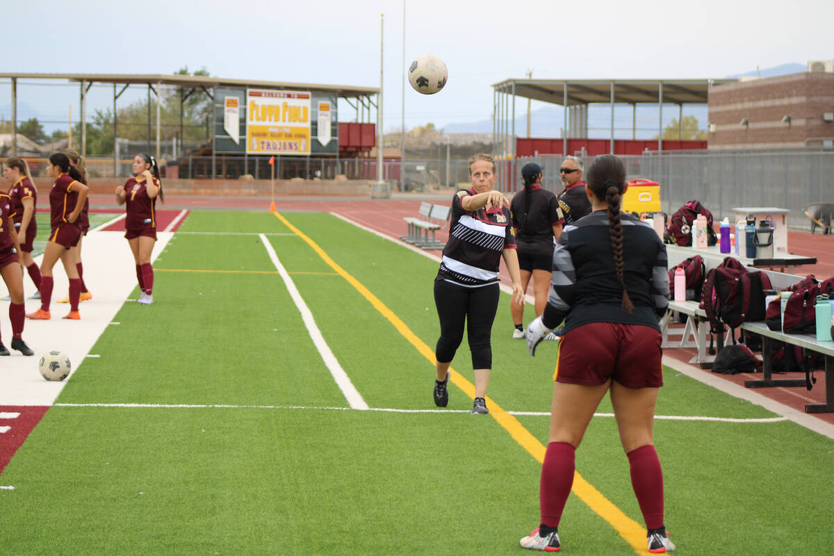 Pahrump Valley High School varsity soccer head coach Amy Carlson warms up with junior goalkeepe ...