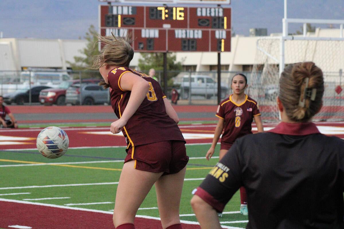 Pahrump Valley High School Trojans junior Sydney Crotty headers an inbound pass in a home leagu ...