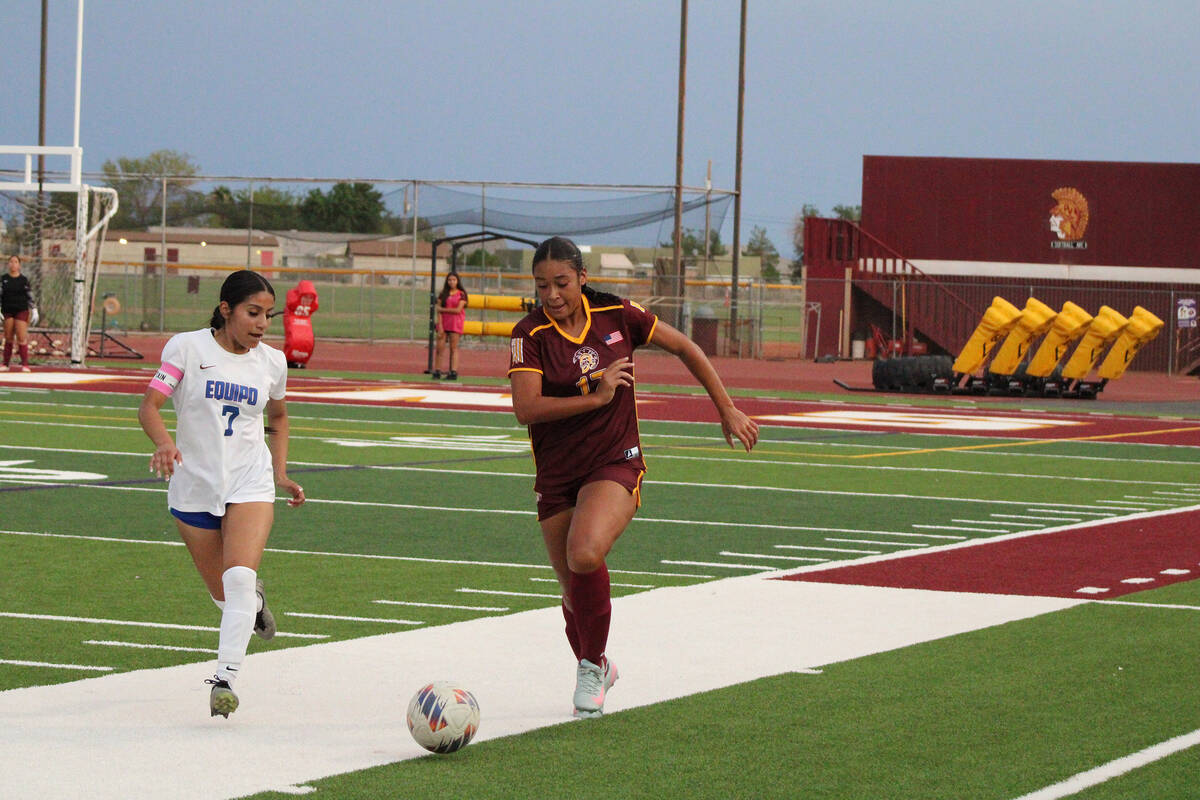 Pahrump Valley High School senior Sarah Brown-Collins advances the ball forward up the line in ...