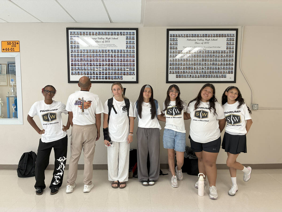 Some of the Pahrump Valley Lady Trojans tennis players show off their new sponsorship T-shirts ...