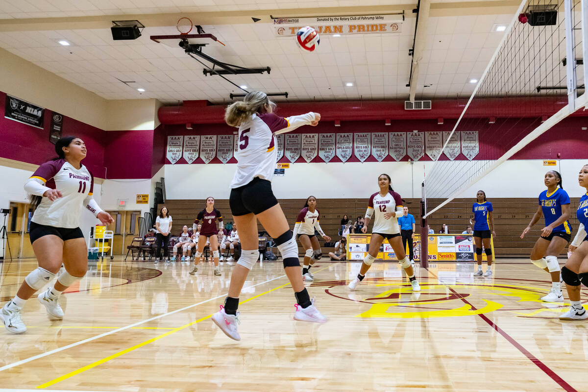 Lady Trojans senior Amaliah Mendoza returns a serve in a home league match against the Democrac ...