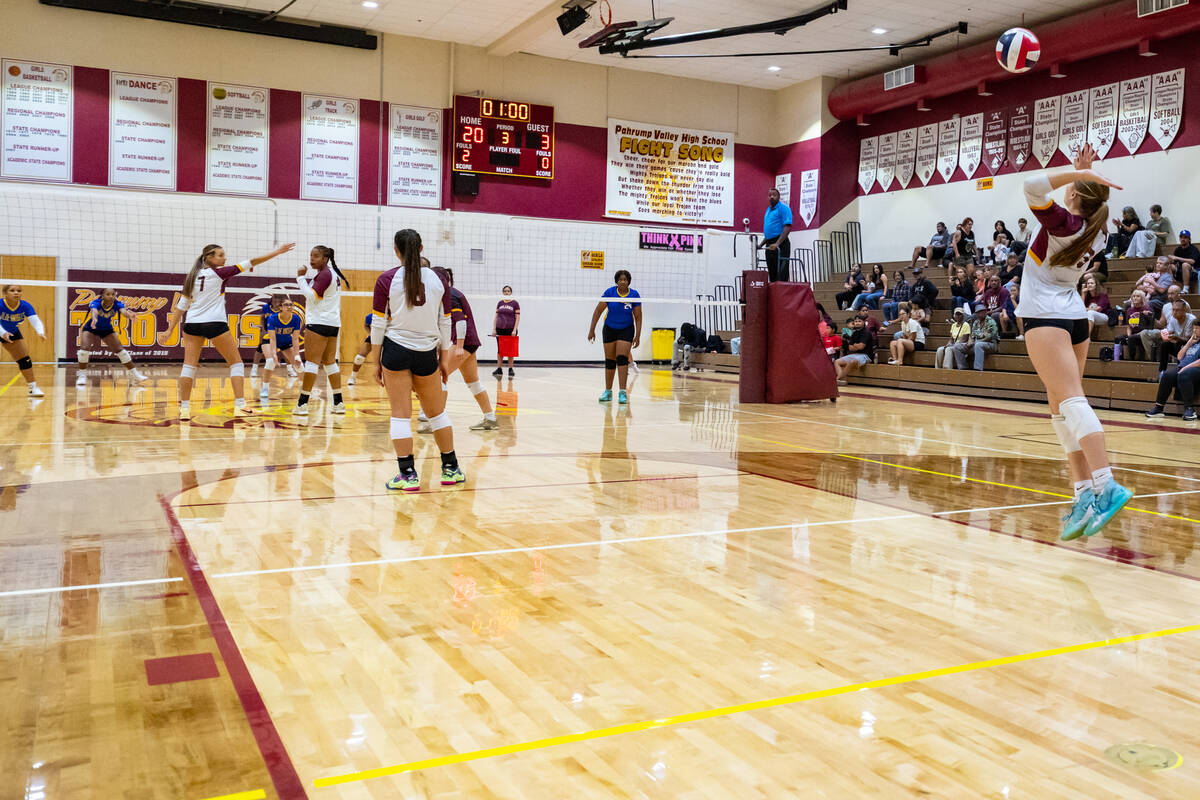 Lady Trojans senior S/Opp Nala Dalton picks up an ace in a match against the Democracy Prep Blu ...