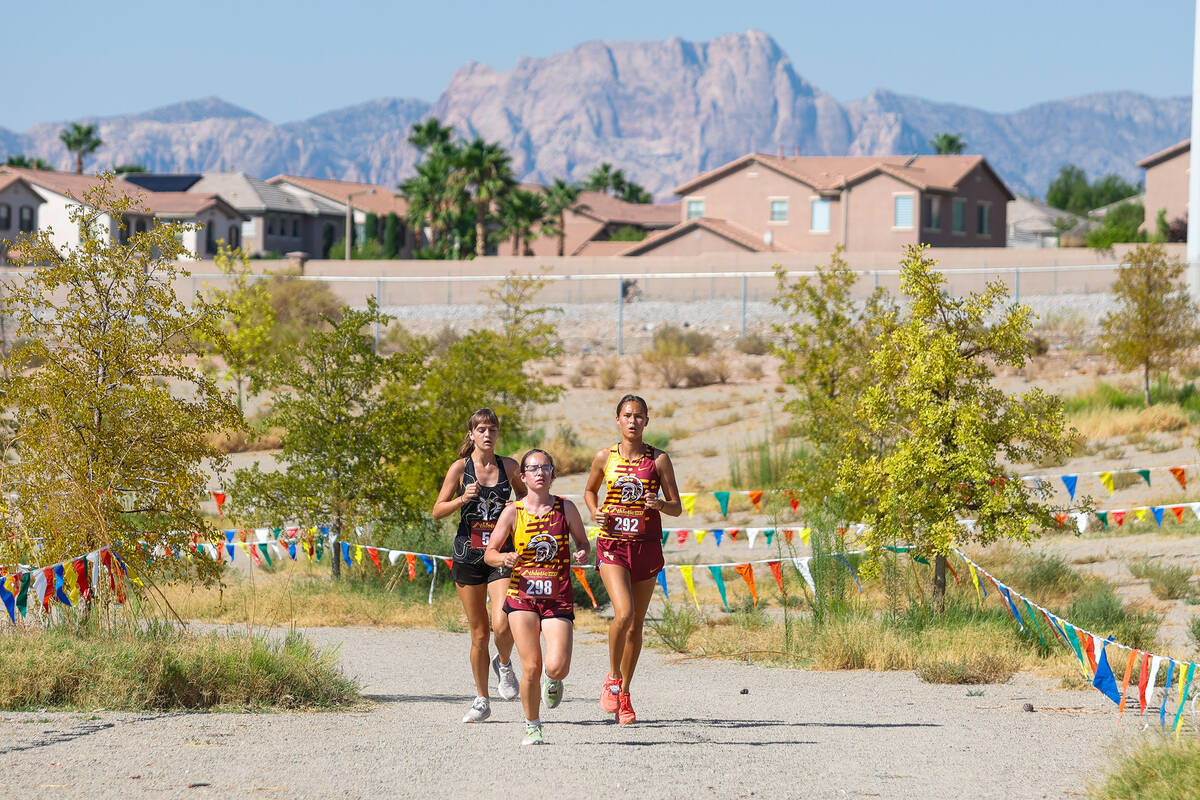 Runners from Clark and Pahrump Valley High School during the Junior/Senior Girls portion of the ...