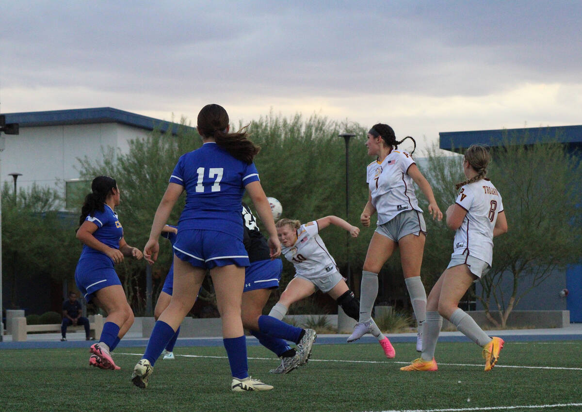 Pahrump Valley High School senior co-captain Aubrey Williams heads a ball away from Cristo Rey ...