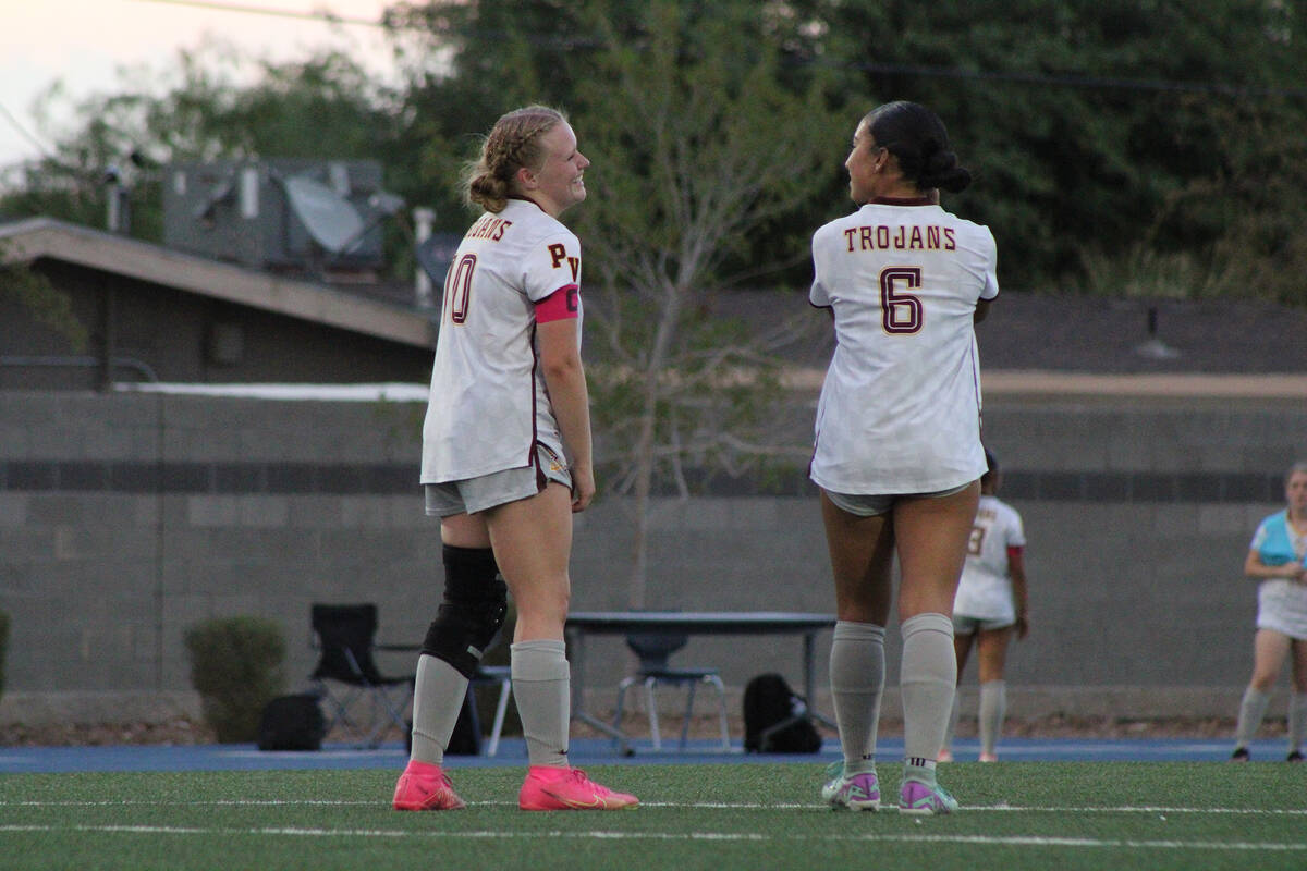 Pahrump Valley High School senior co-captains Natalia Vallin and Aubrey Williams share a laugh ...