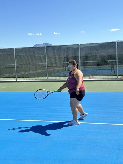 Pahrump Valley High School tennis athlete Melinda Rivera prepares to return a serve in a road l ...