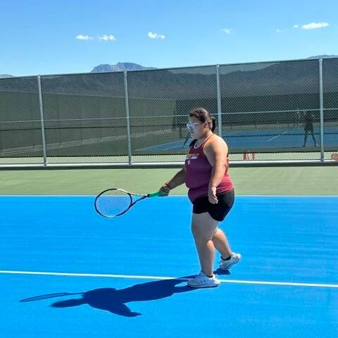 Pahrump Valley High School tennis athlete Melinda Rivera prepares to return a serve in a road l ...