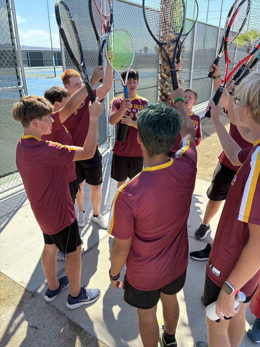 The Pahrump Valley High School boys tennis team gathers for a rally chant before taking on the ...