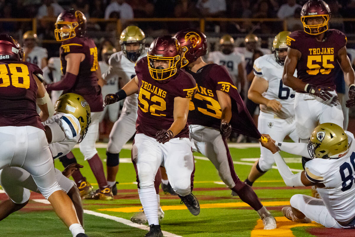Pahrump Valley High School junior offensive guard Preston Doctor anticipates a block against Sp ...