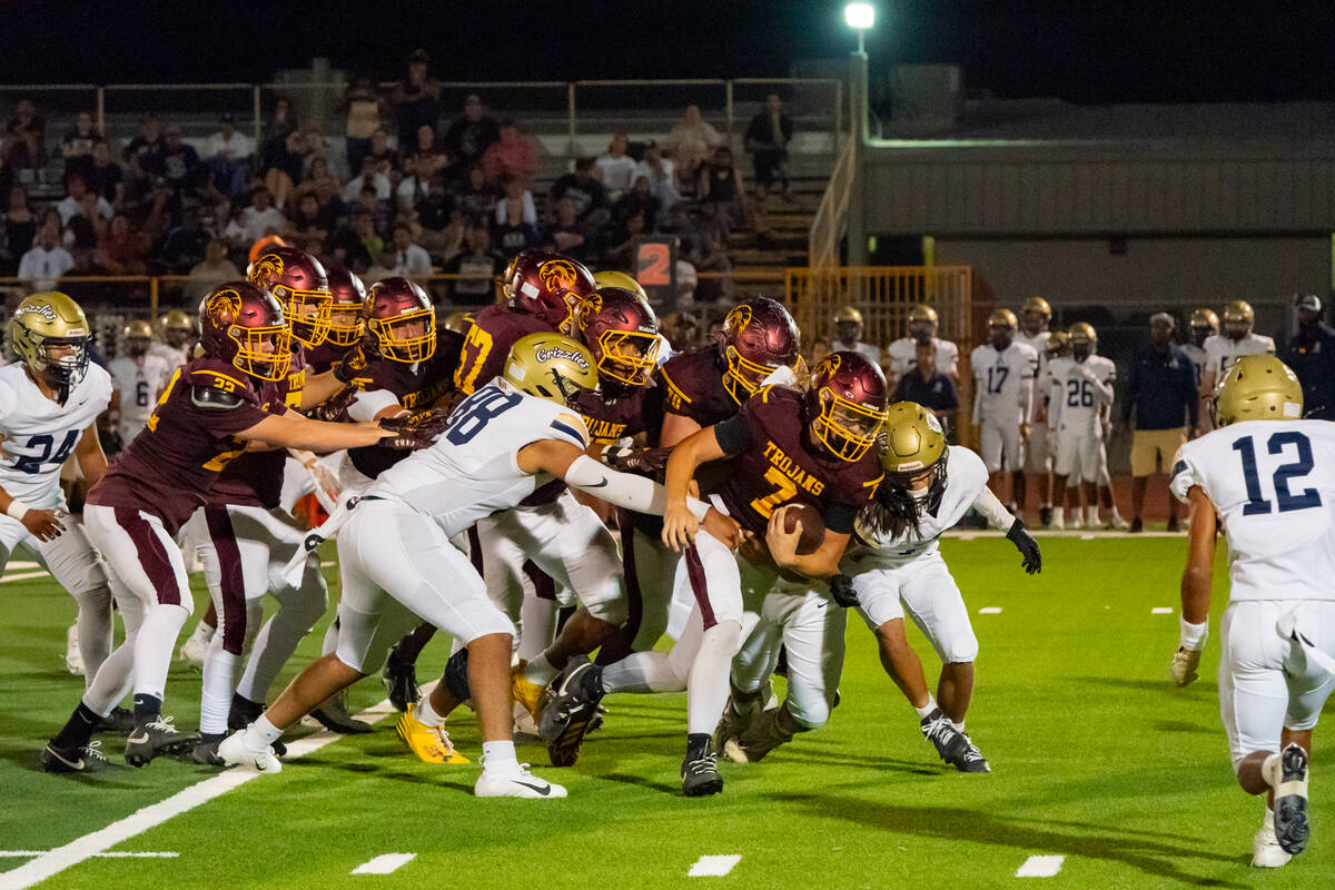 Pahrump Valley High School junior wideout Ryan Hamlin carries the ball forward against Spring V ...