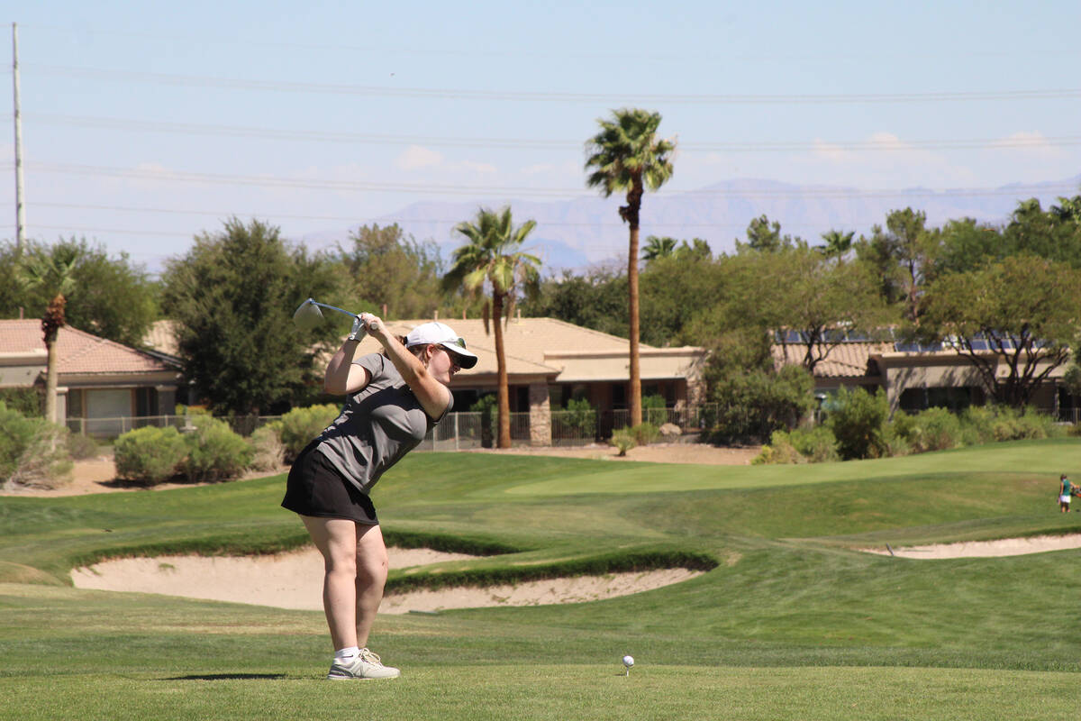 Pahrump Valley High School girls golf senior Tiffany Sartin prepares to finish her stroke in a ...