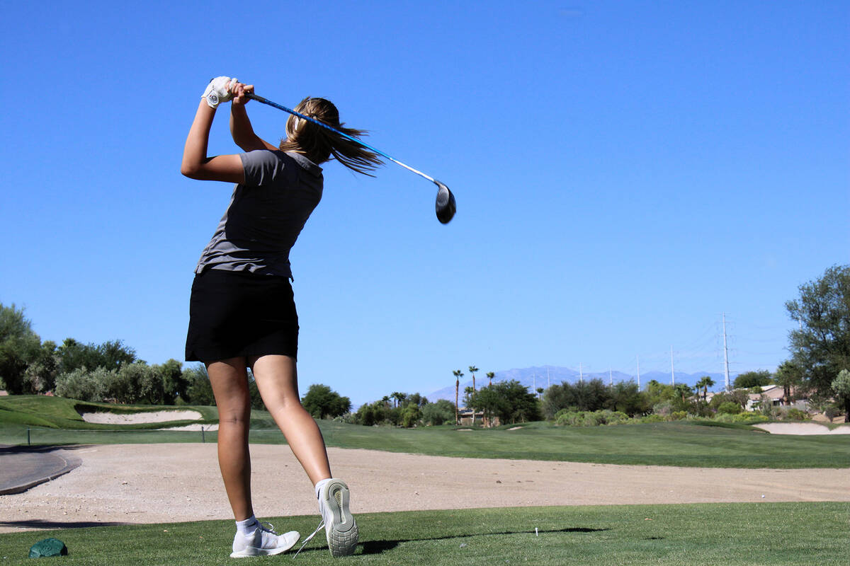 Pahrump Valley High School girls golf freshman Raegan Saldana finishes her follow through in a ...