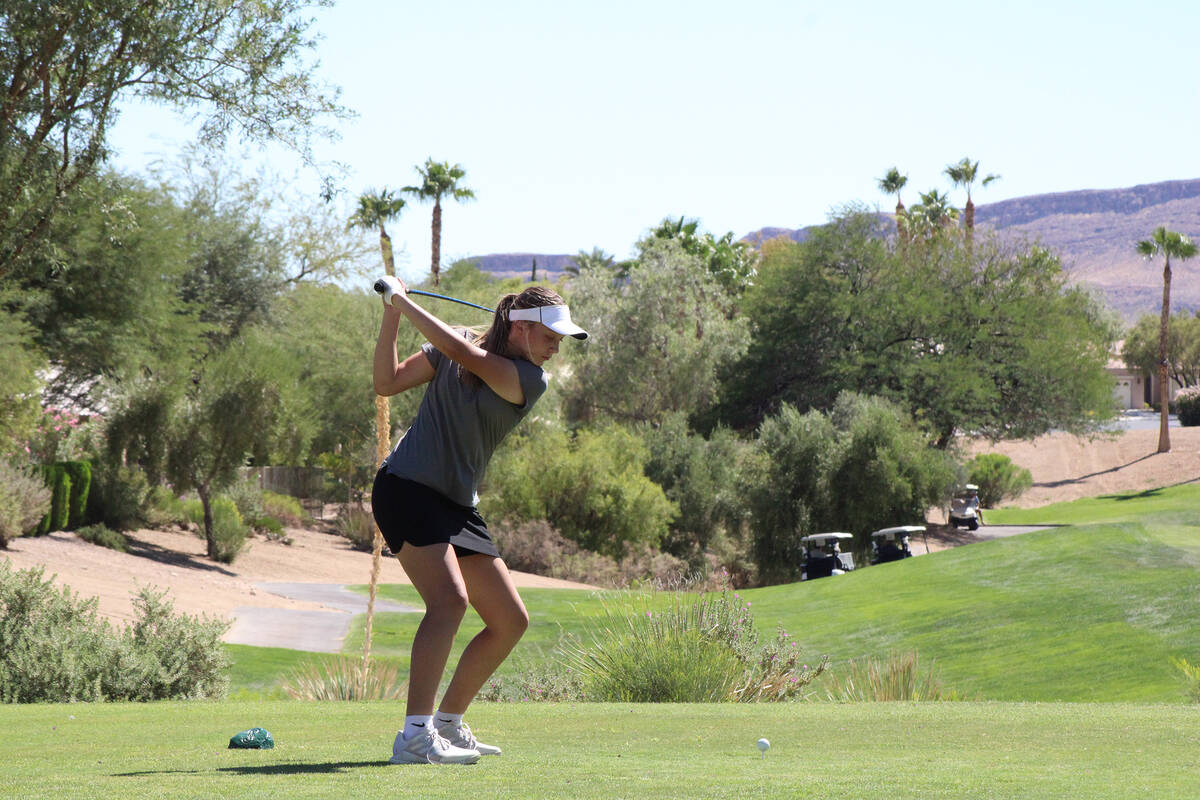 Pahrump Valley High School girls golf freshman Raegan Saldana gets ready to tee off in their to ...