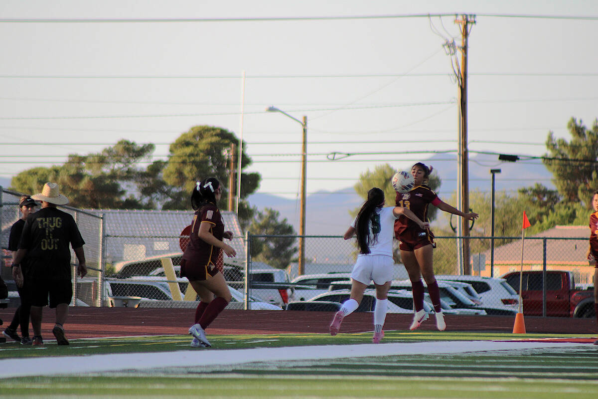 Pahrump Valley High School girls soccer junior co-captain Natalie Soto bodies the ball to keep ...