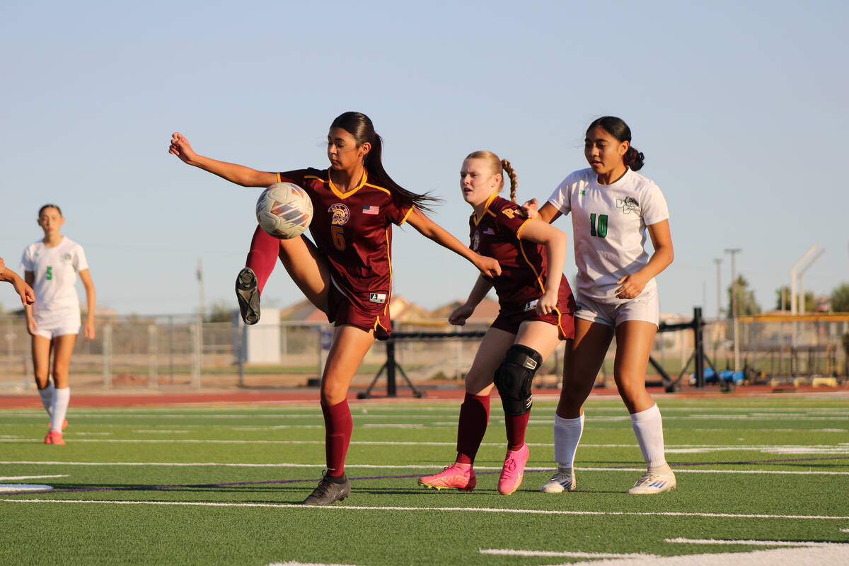 Pahrump Valley High School girls soccer freshman Melissa Nunez-Ramirez knees the ball in a home ...