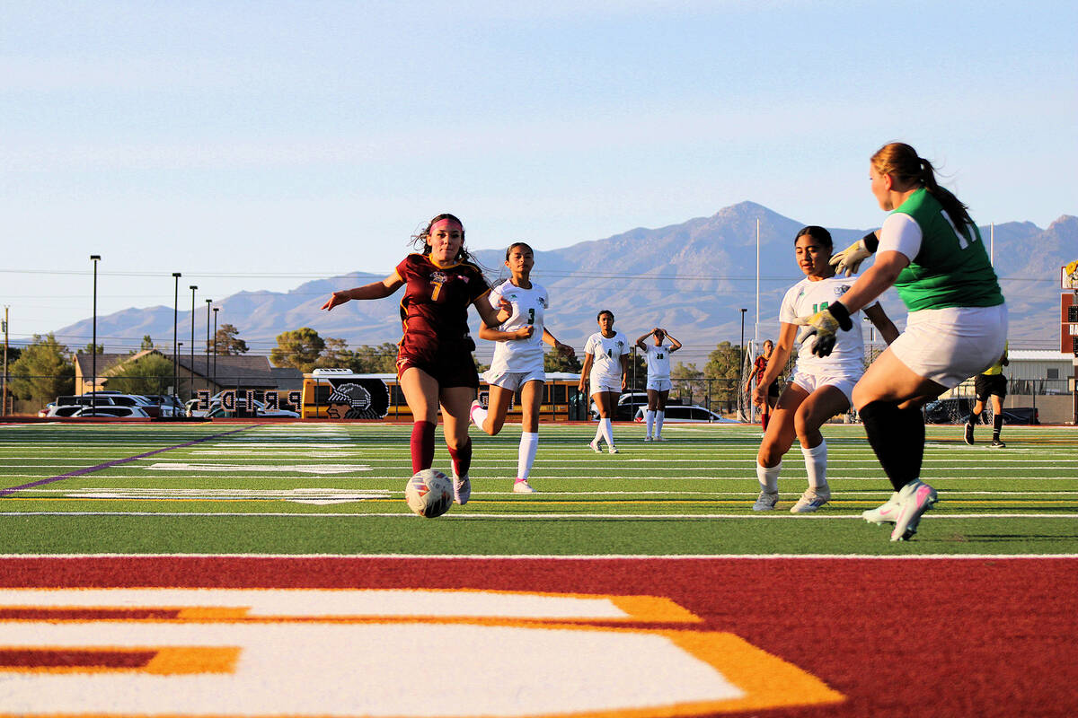 Pahrump Valley High School girls soccer junior Juliana Shepard-Lopez advances the ball near the ...