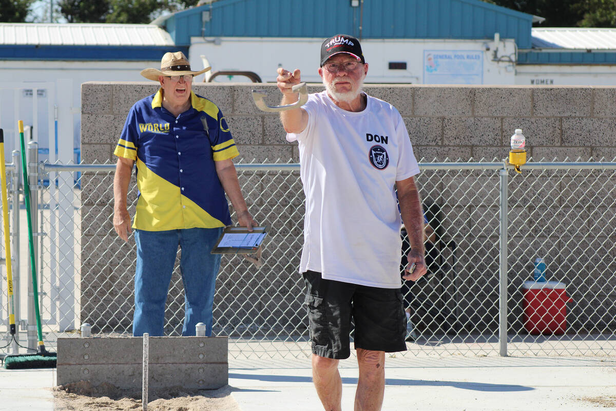 Nevada State Horseshoe Pitching Association pitcher Don Brown lets a shoe fly during his match ...