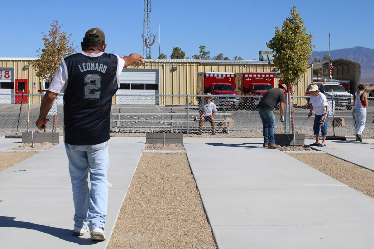 Nevada State Horseshoe Pitching Association pitcher Benny Sanchez from Amargosa throws from a m ...