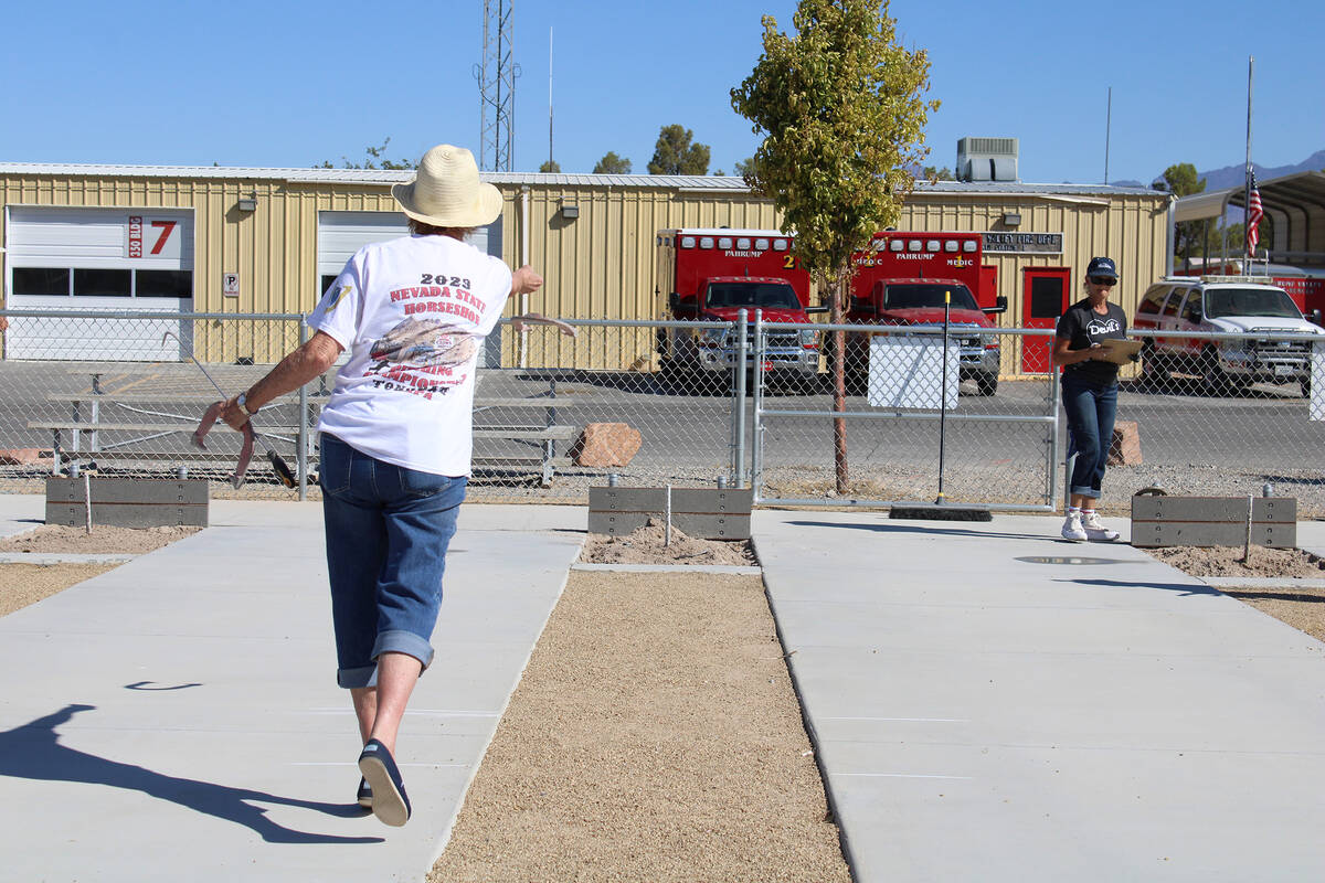 Nevada State Horseshoe Pitching Association pitcher Karen Semplinski tosses one back during the ...