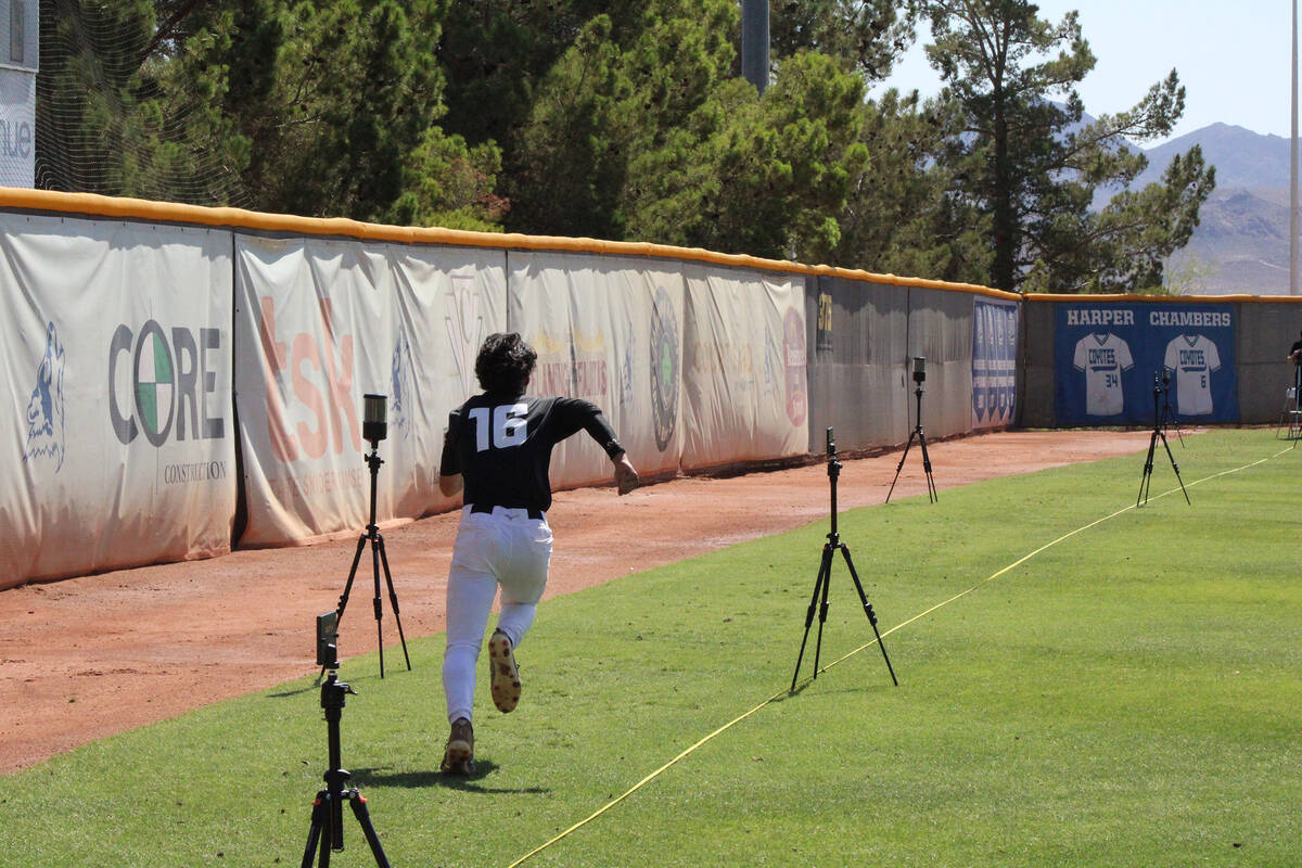 Pahrump Valley High School class of 2027 shortstop Tony Whitney flies down left field during a ...