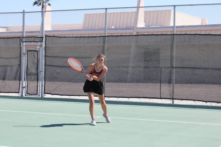 Pahrump Valley High School tennis senior Elise Eichner returns a comfortable serve in a home le ...