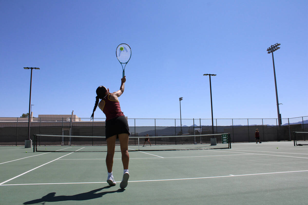 Pahrump Valley High School tennis sophomore Aurora Bowers serves up a great ball in warm-ups be ...