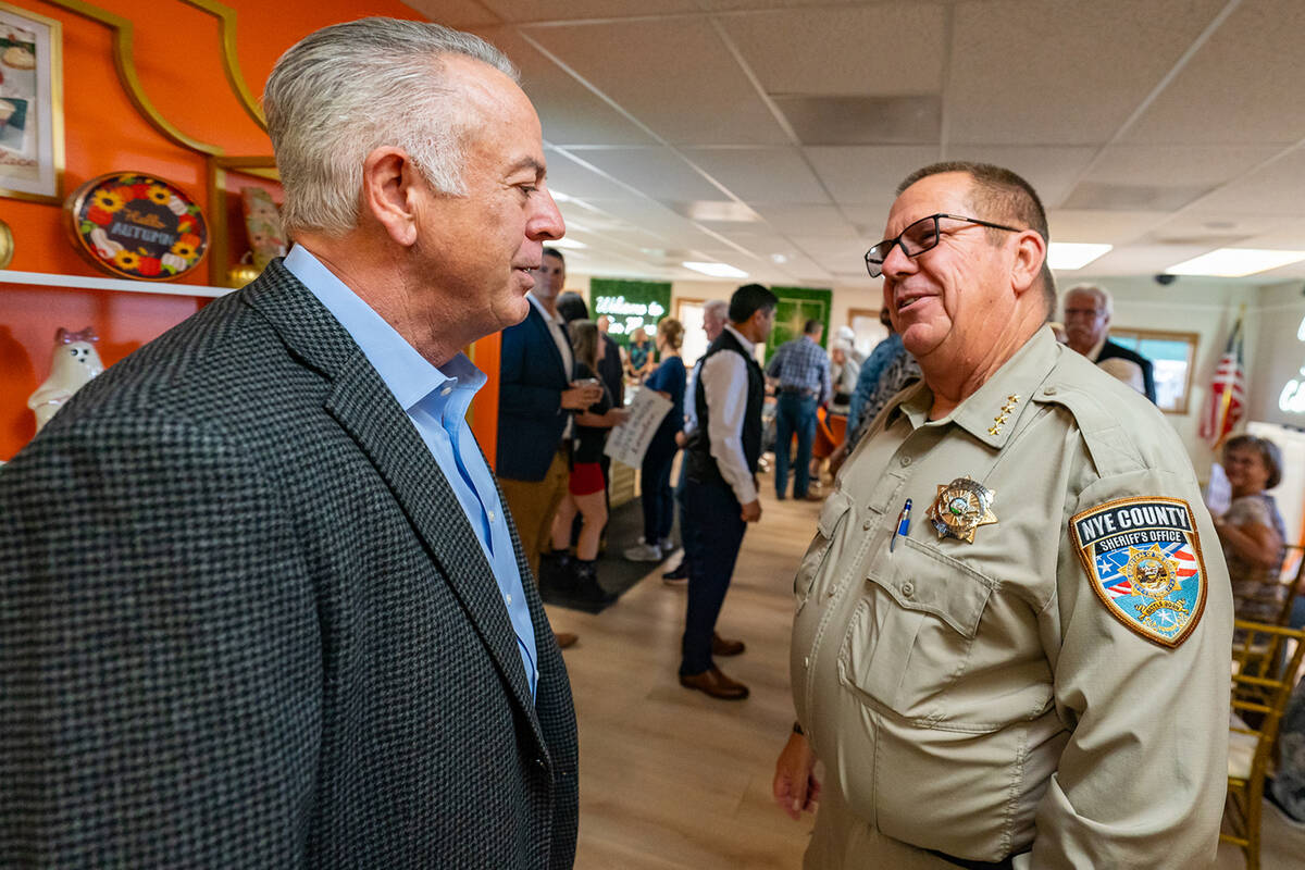 Nevada Gov. Joe Lombardo chats with Nye County Sheriff Joe McGill during Monday's event. (John ...