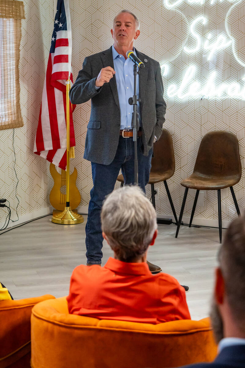 Nye County Judge Kimberly Wanker listens as Governor Joe Lombardo speaks at Our Place Coffee in ...