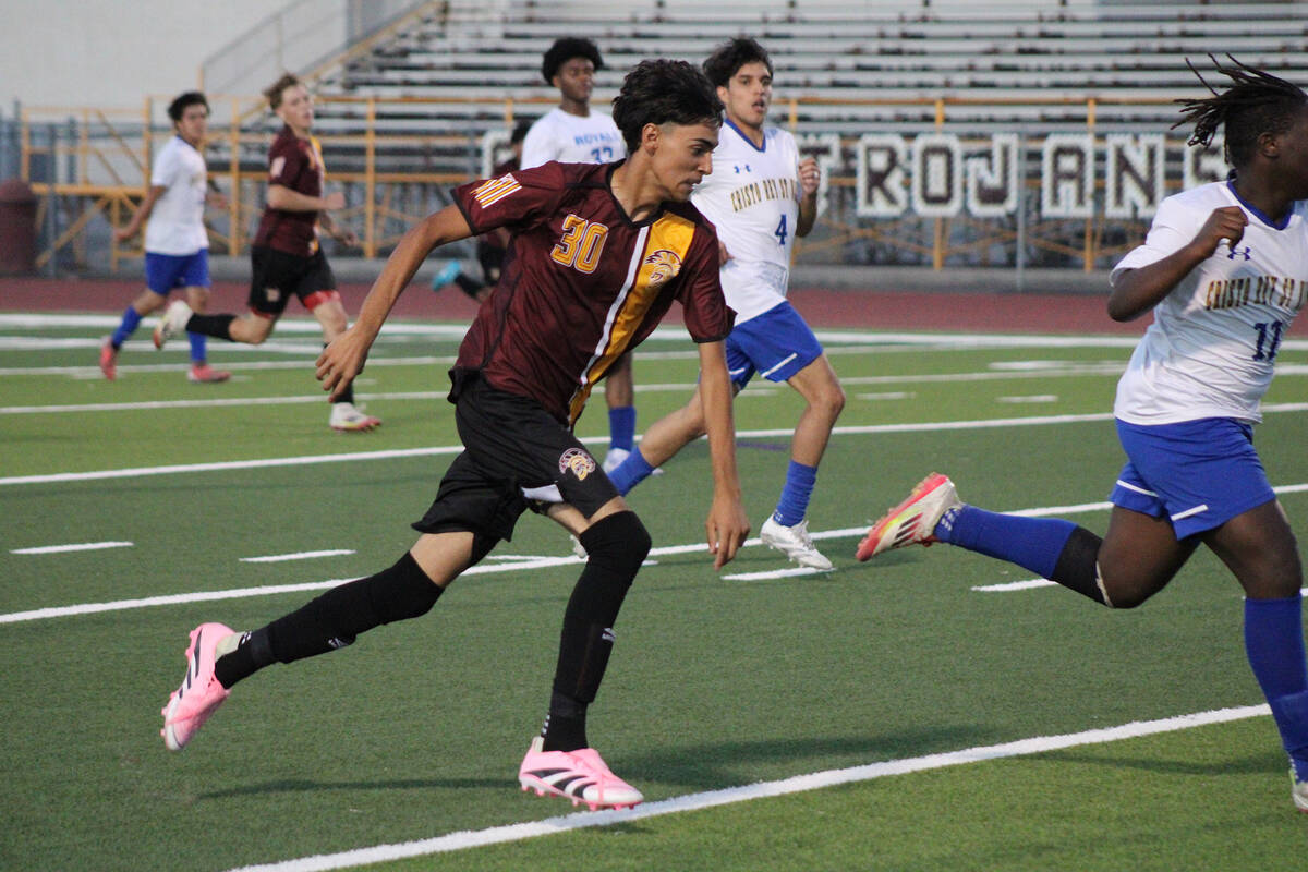 Pahrump Valley High School boys soccer sophomore midfielder Roberto Gonzalez advances the ball ...