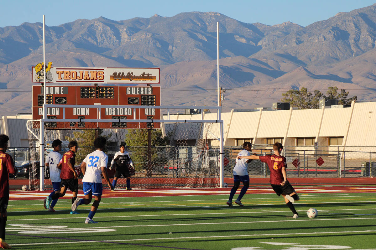 Pahrump Valley High School junior midfielder Samuel Mendoza attempts a shot on goal in a home l ...
