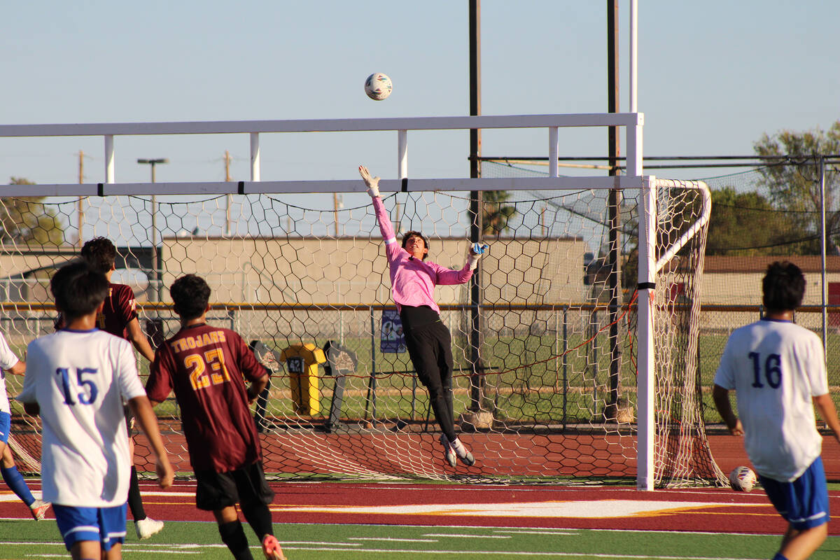 Pahrump Valley High School senior goalkeeper Cayden Cowley stretches wide to block a shot in a ...