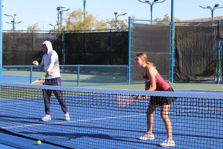 Pahrump Valley High School tennis senior Elise Eichner and head coach Michael Dela Rosa have so ...