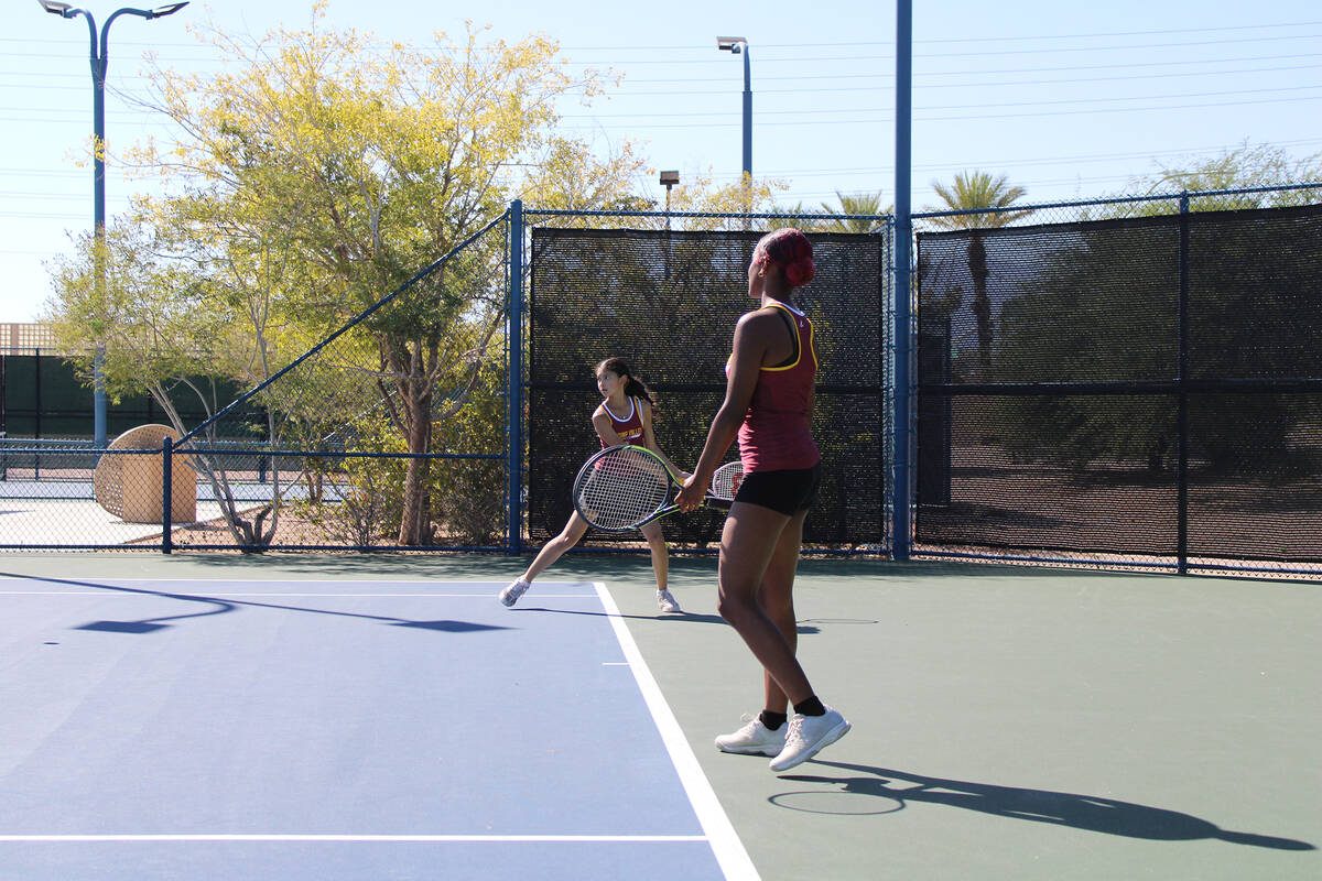 Pahrump Valley High School doubles teammates Chanel Anthony and Allison Amador focus in their d ...