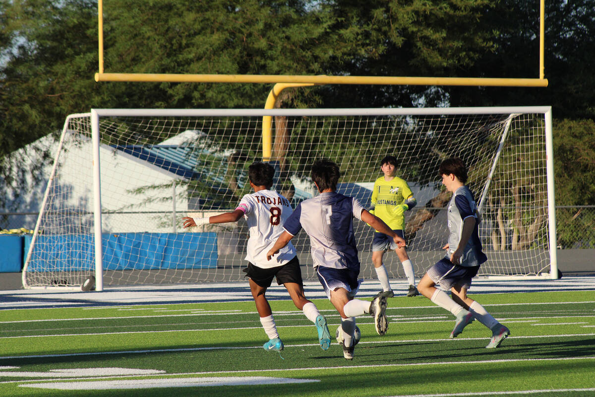 Pahrump Valley High School junior midfielder Ryan Nunez Manzo advances the ball up near The Mea ...