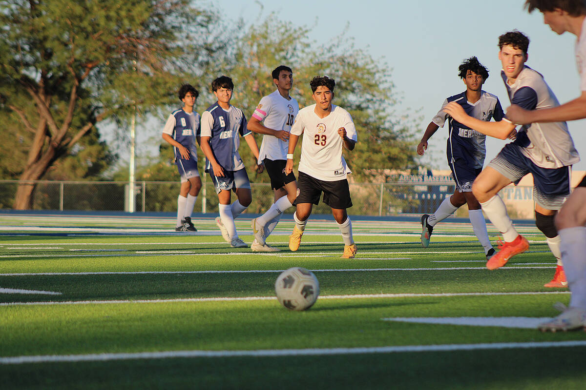 Pahrump Valley High School Trojans Favyan Sida passes the ball away in a road league match agai ...