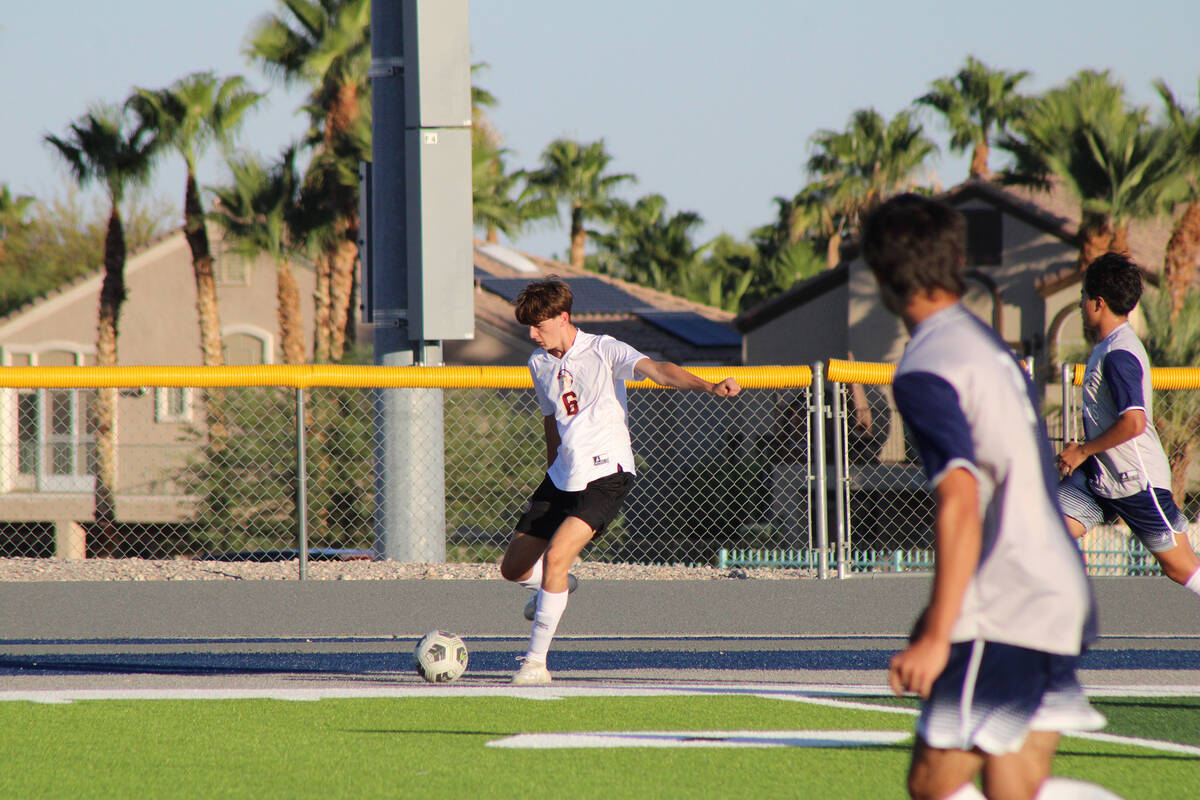 Pahrump Valley High School junior midfielder Samuel Mendoza sends the ball deep on a lobby agai ...