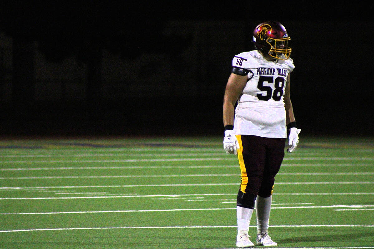 Pahrump Valley High School junior DL.OL Luca Blundo prepares to put his defense in the best pos ...