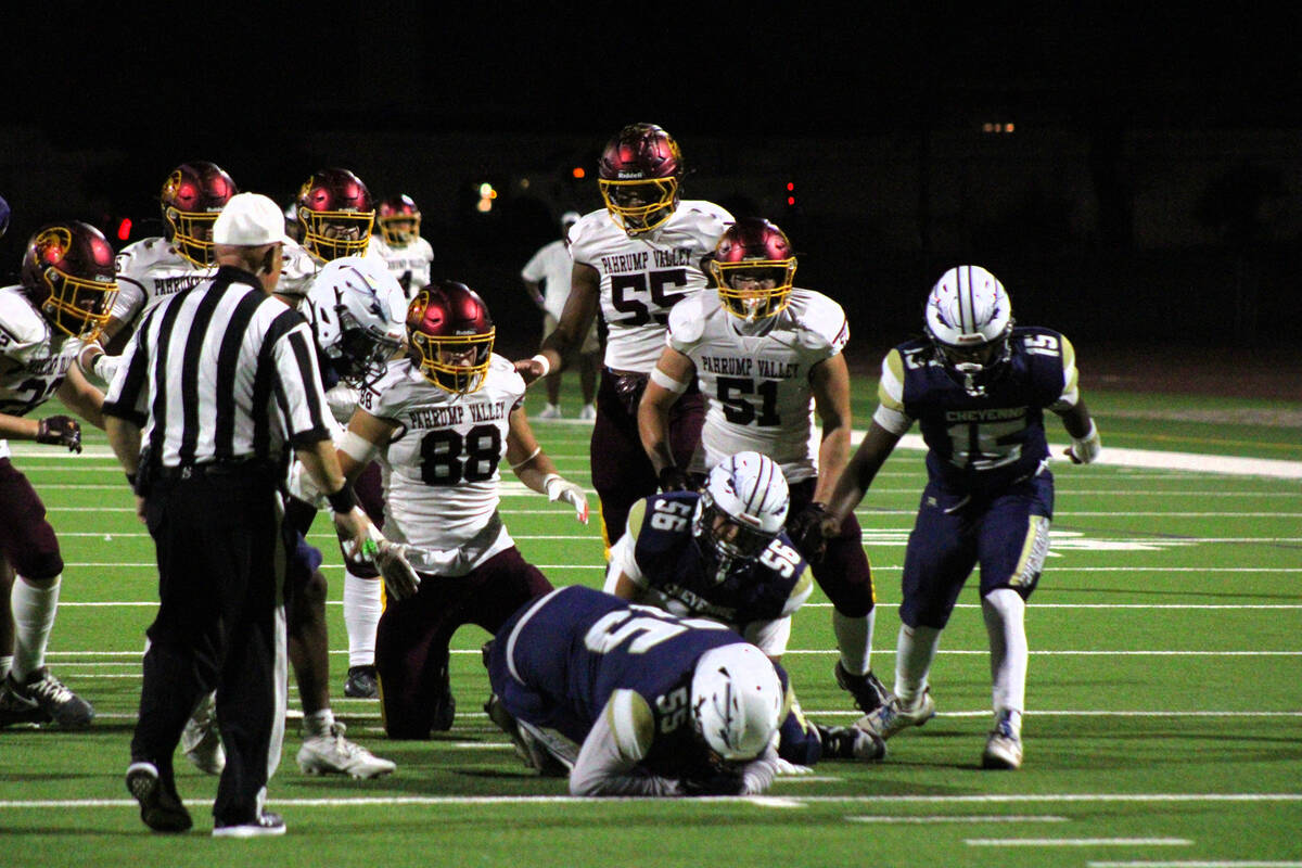 Pahrump Valley High School football defenders try to recover a fumble forced by junior DE/TE Gi ...