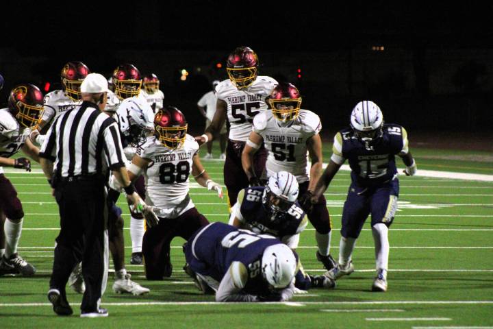 Pahrump Valley High School football defenders try to recover a fumble forced by junior DE/TE Gi ...