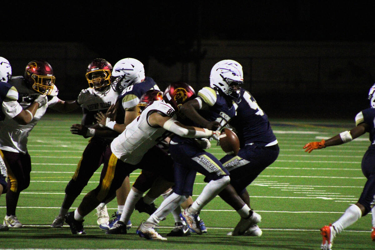 Pahrump Valley High School junior DE/TE Gideon Wydick forces a fumble on defense against Cheyen ...