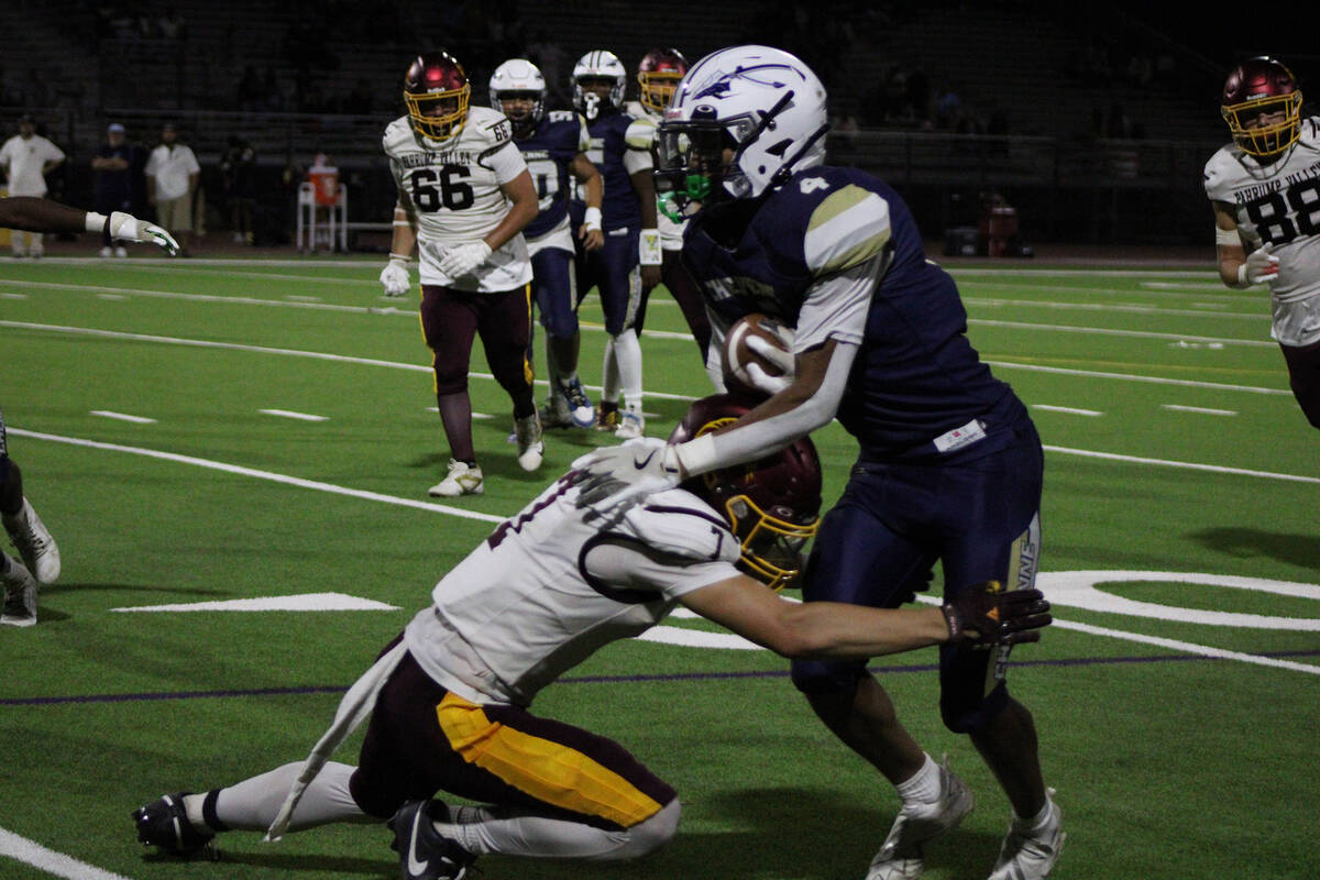Pahrump Valley High School junior wideout Ryan Hamlin makes the tackle on Cheyenne High School ...