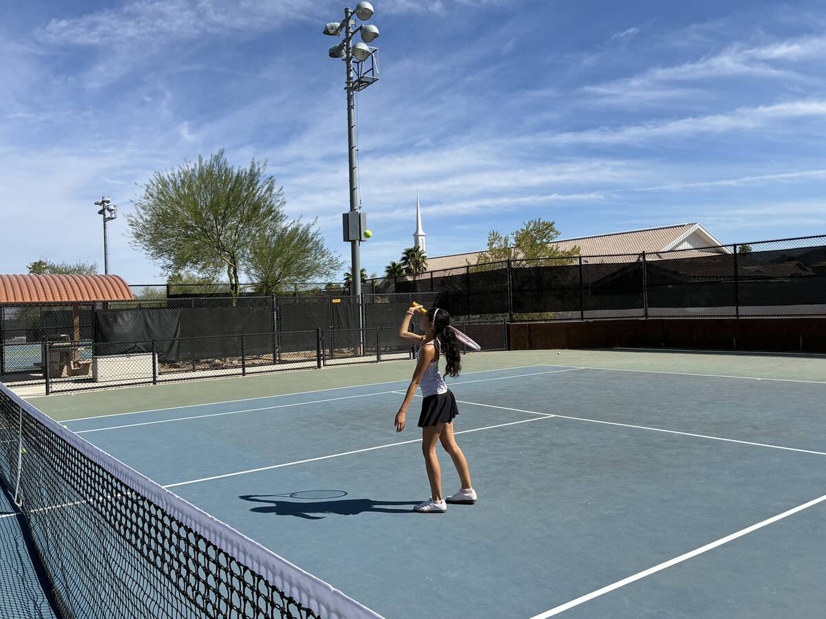 Pahrump Valley High School sophomore Allison Amador prepares a serve to her opponent in league ...
